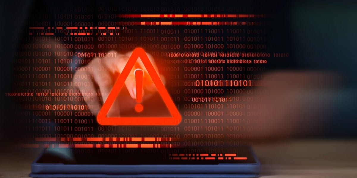 Red warning exclamation icon over binary code background, symbolizing cyber attack alert, system error, malware threat, hacking breach