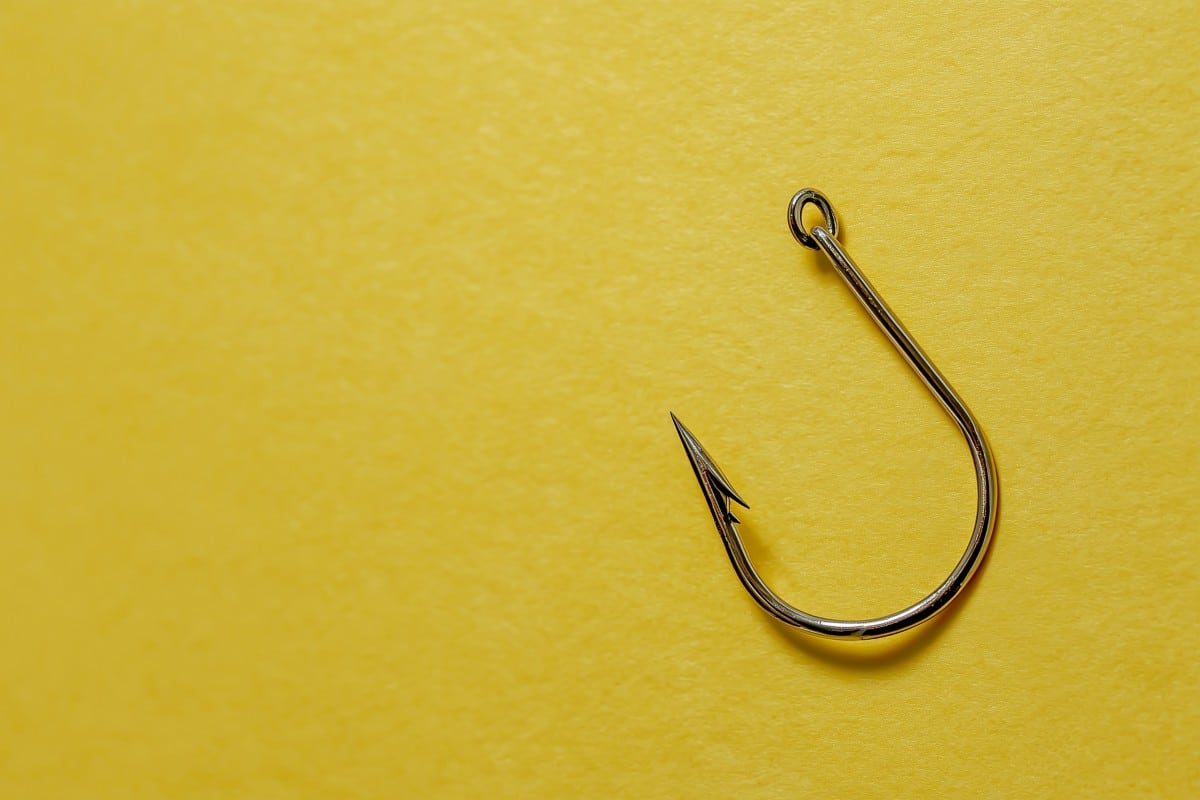 fishing hook on a yellow background