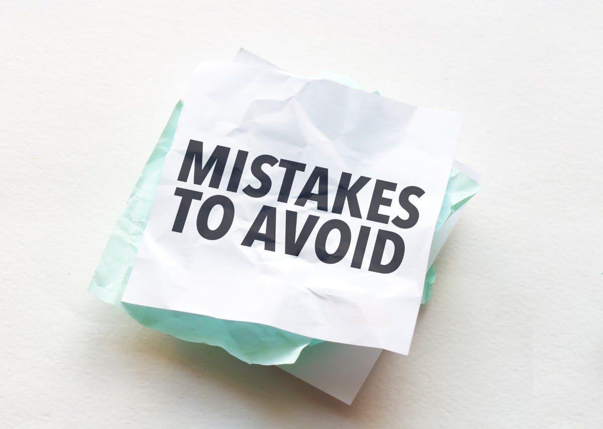 paper with text Mistakes To Avoid on white background