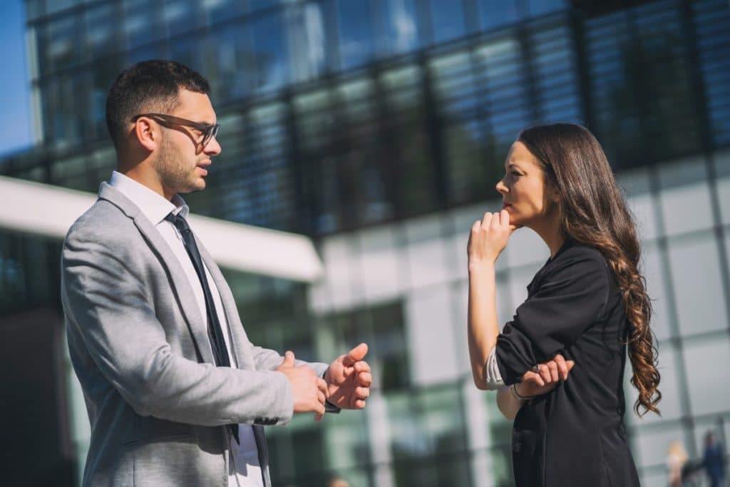  colleagues are talking outside the company building