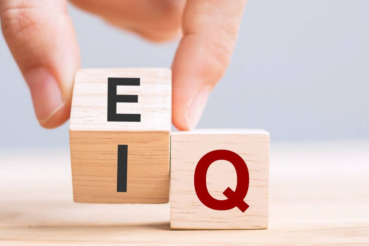 letters E and Q on small wooden block