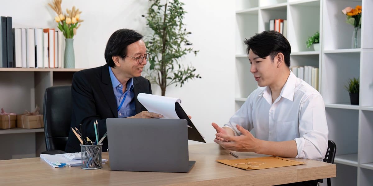 Professional agent reviewing policy with client