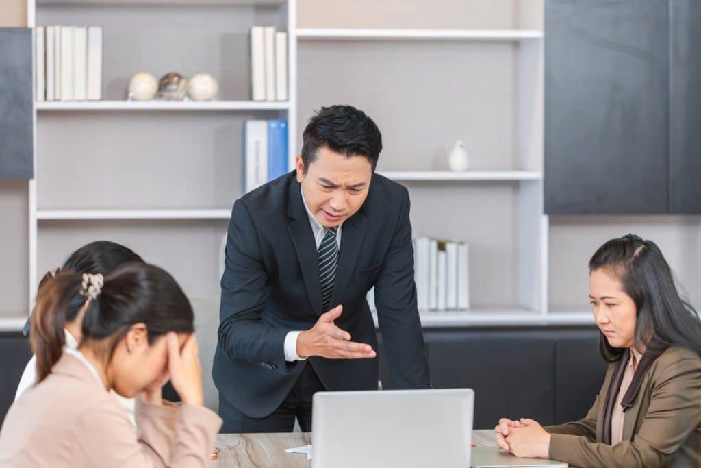 Group of coworkers in a conference room during the meeting