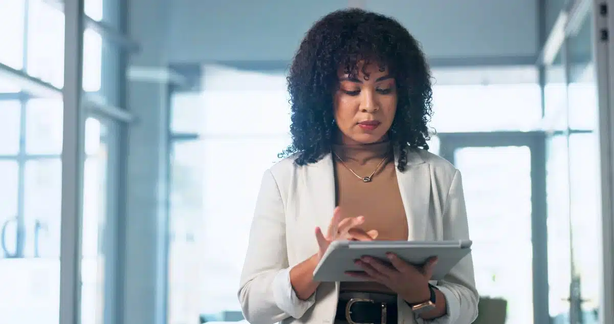 Review, info and woman with tablet in office, paralegal and planning for trial with research on web
